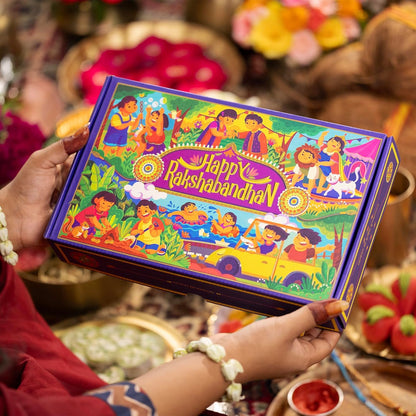 9-in-1 Rakhi Gift Box for Brother & Bhabhi | Combo of 2 Rakhis (Rudraksha & Ocean Gaze) | Farmley Dry Fruit Mix, Party Mix | Eat Better Millet Namkeen | Guru Chela Mouth Freshener | Greeting Card