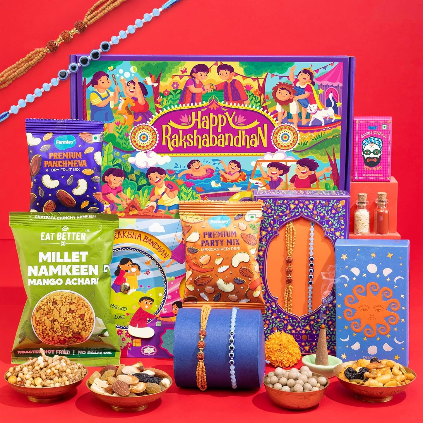 9-in-1 Rakhi Gift Box for Brother & Bhabhi | Combo of 2 Rakhis (Rudraksha & Ocean Gaze) | Farmley Dry Fruit Mix, Party Mix | Eat Better Millet Namkeen | Guru Chela Mouth Freshener | Greeting Card